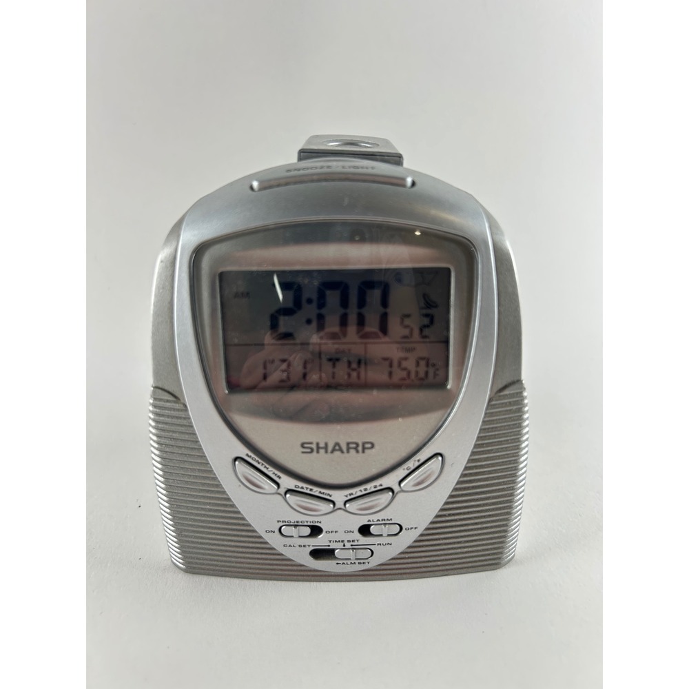 Sharp Projection Alarm Clock 
Red Time projection Silver Digital SPC378
Battery